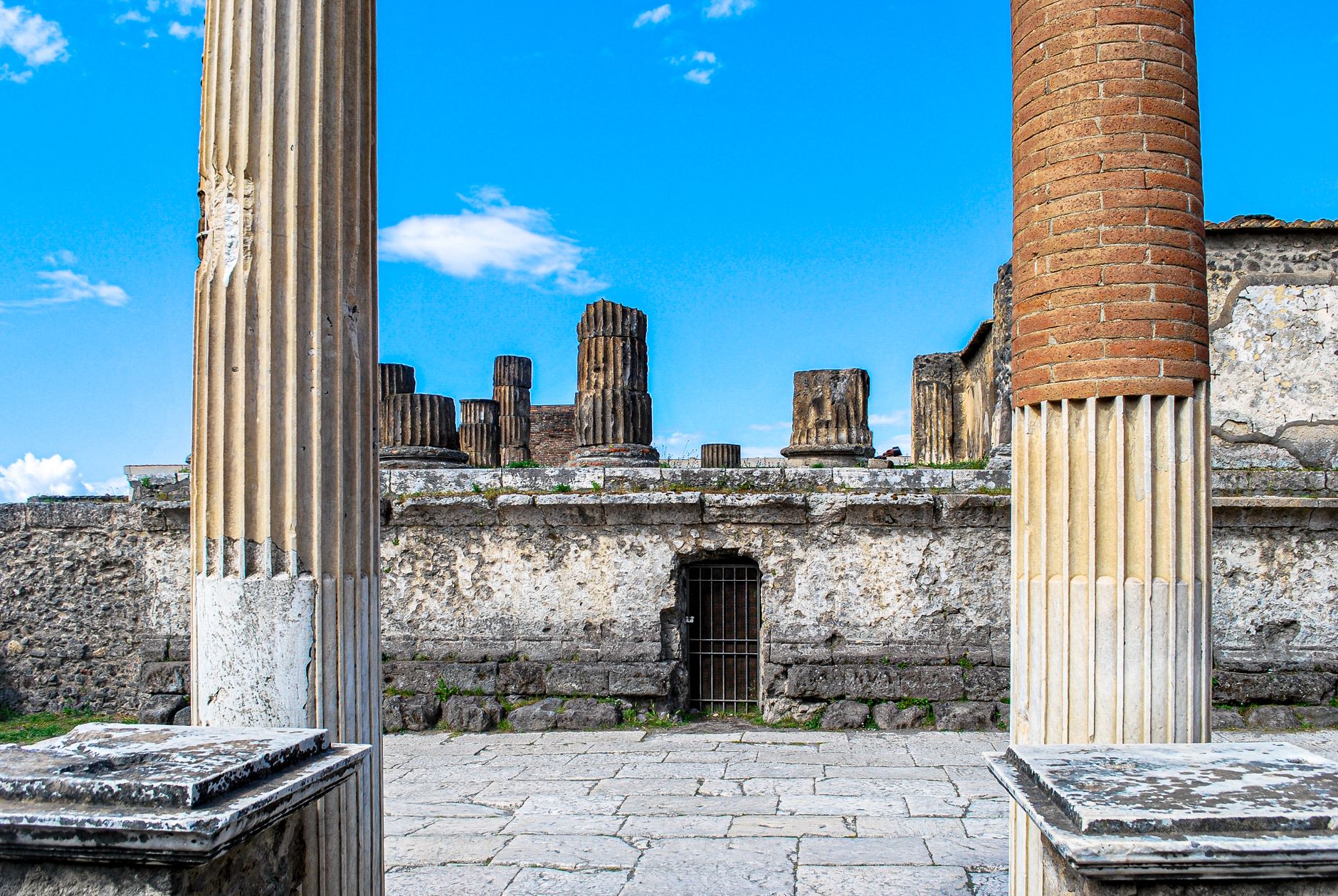 Explore the ancient Roman columns and ruins at Pompeii, showcasing historical architecture. Perfect for travel
